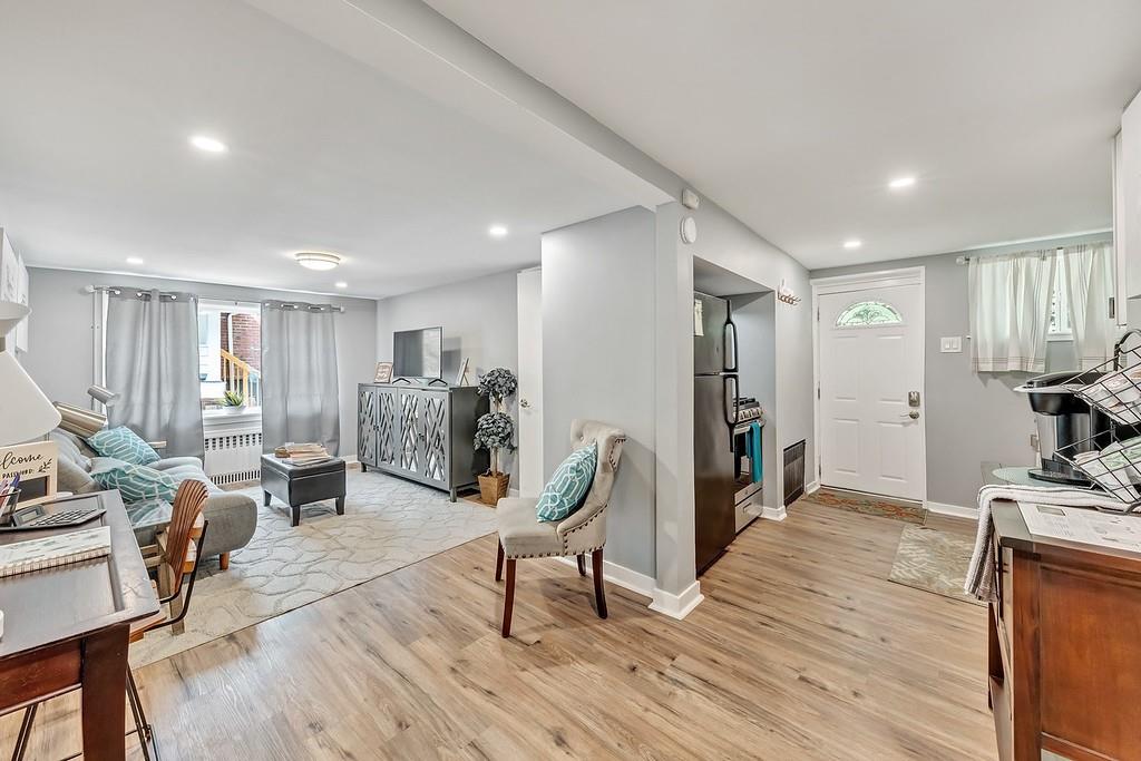 6206 Ira Way Pittsburgh, PA 15217 - Photo 4 of 36 a living room with furniture and a wooden floor