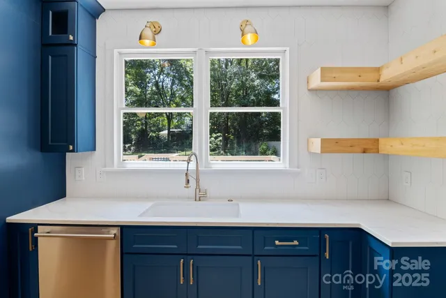 a kitchen with a sink and a window