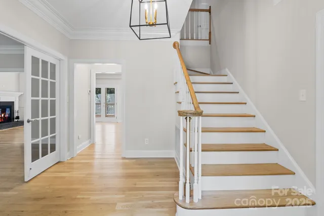 a view of entryway and hall with wooden floor