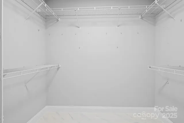 a view of a room with racks on the wall