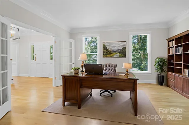 a view of a workspace with a window and lounge chair