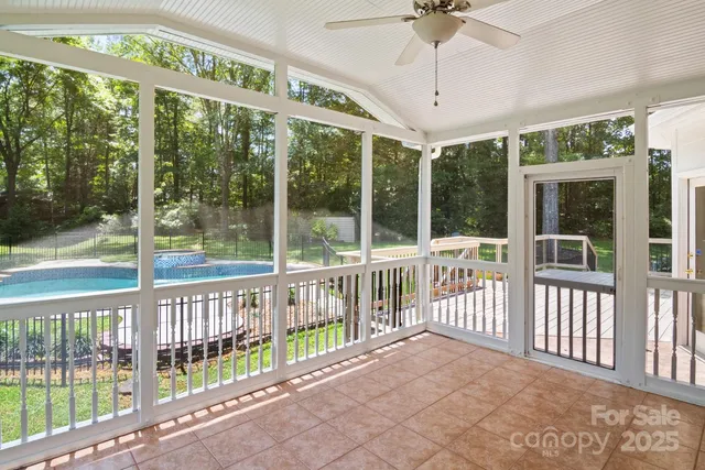 a view of a porch with a floor to ceiling window
