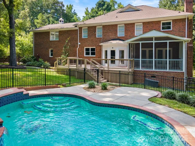 a front view of a house with a yard table and chairs