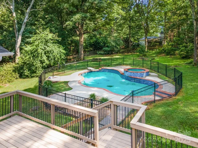 a view of a balcony with two chairs and a table
