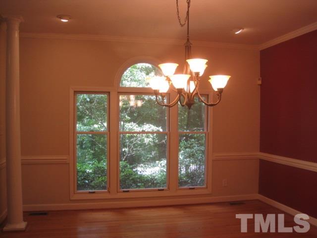 1336 Turner Farms Road Garner, NC 27529 - Photo 4 of 22 Wood floor in large dining room with columns