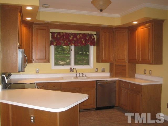 1336 Turner Farms Road Garner, NC 27529 - Photo 5 of 22 Built-in desk, pantry and open to breakfast area. Around the corner from family room.