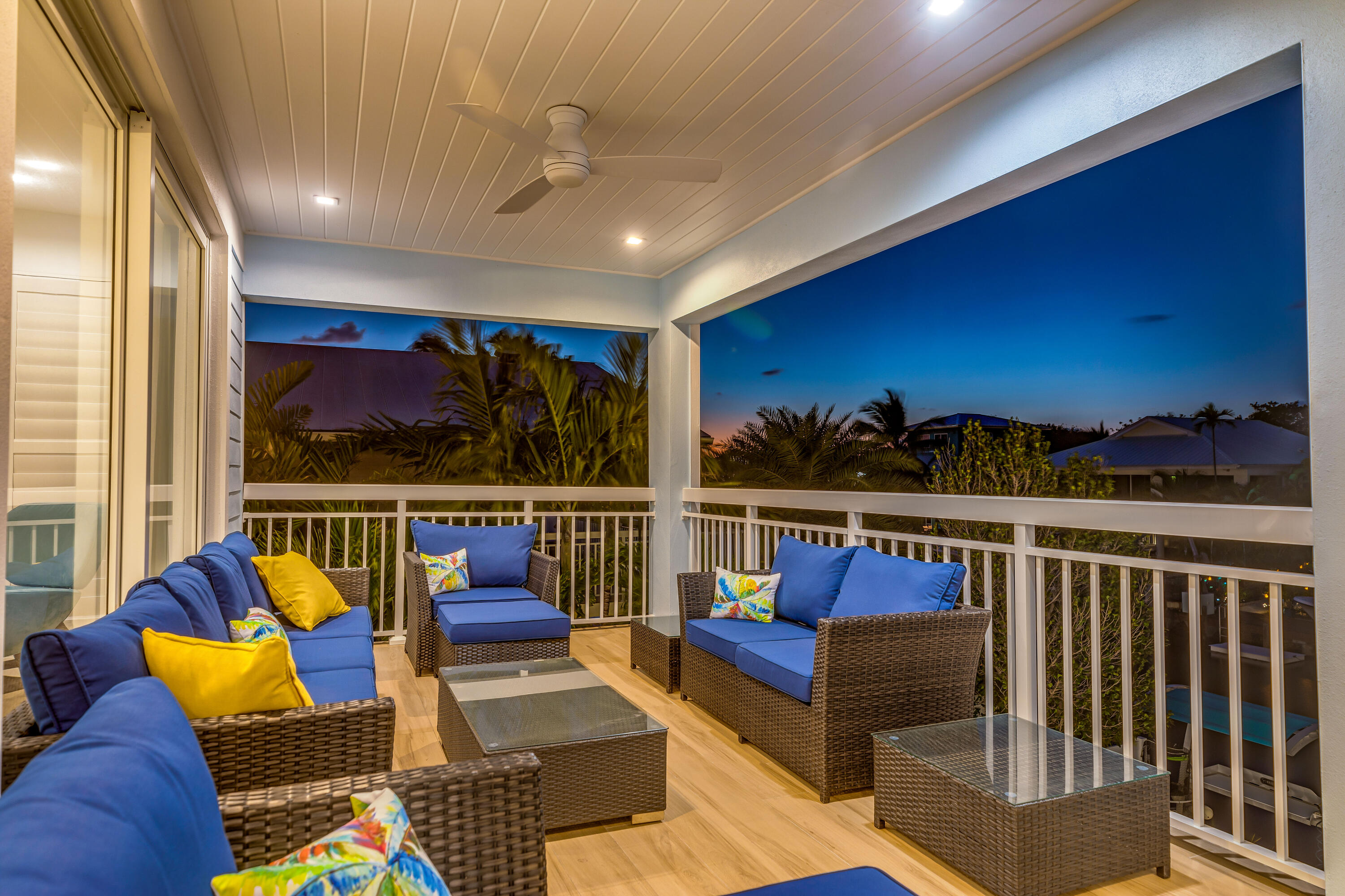 121 Lake Road Tavernier, FL 33070 - Photo 19 of 70 a roof deck with couches and wooden floor