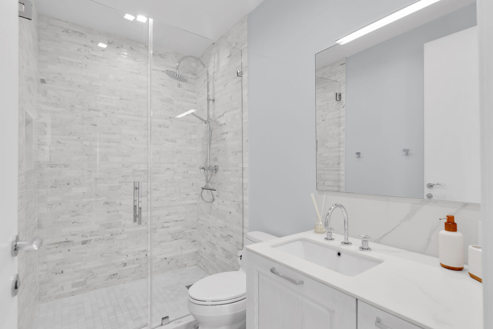 121 Lake Road Tavernier, FL 33070 - Photo 24 of 51 a bathroom with a sink toilet a mirror and shower