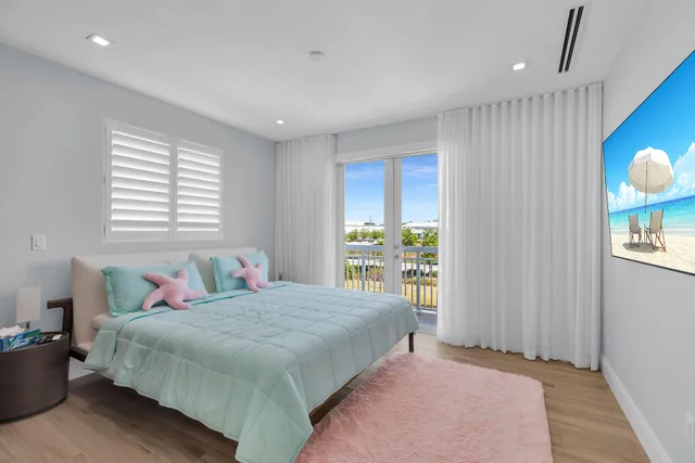 a bedroom with a large bed and a window