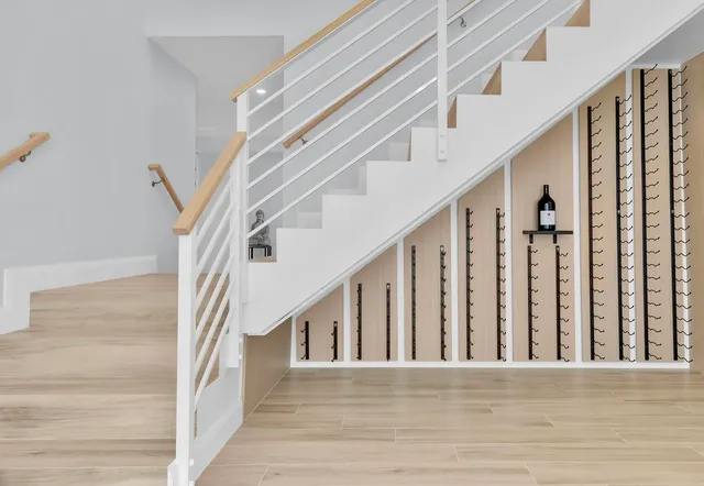 a view of staircase with white walls and a window
