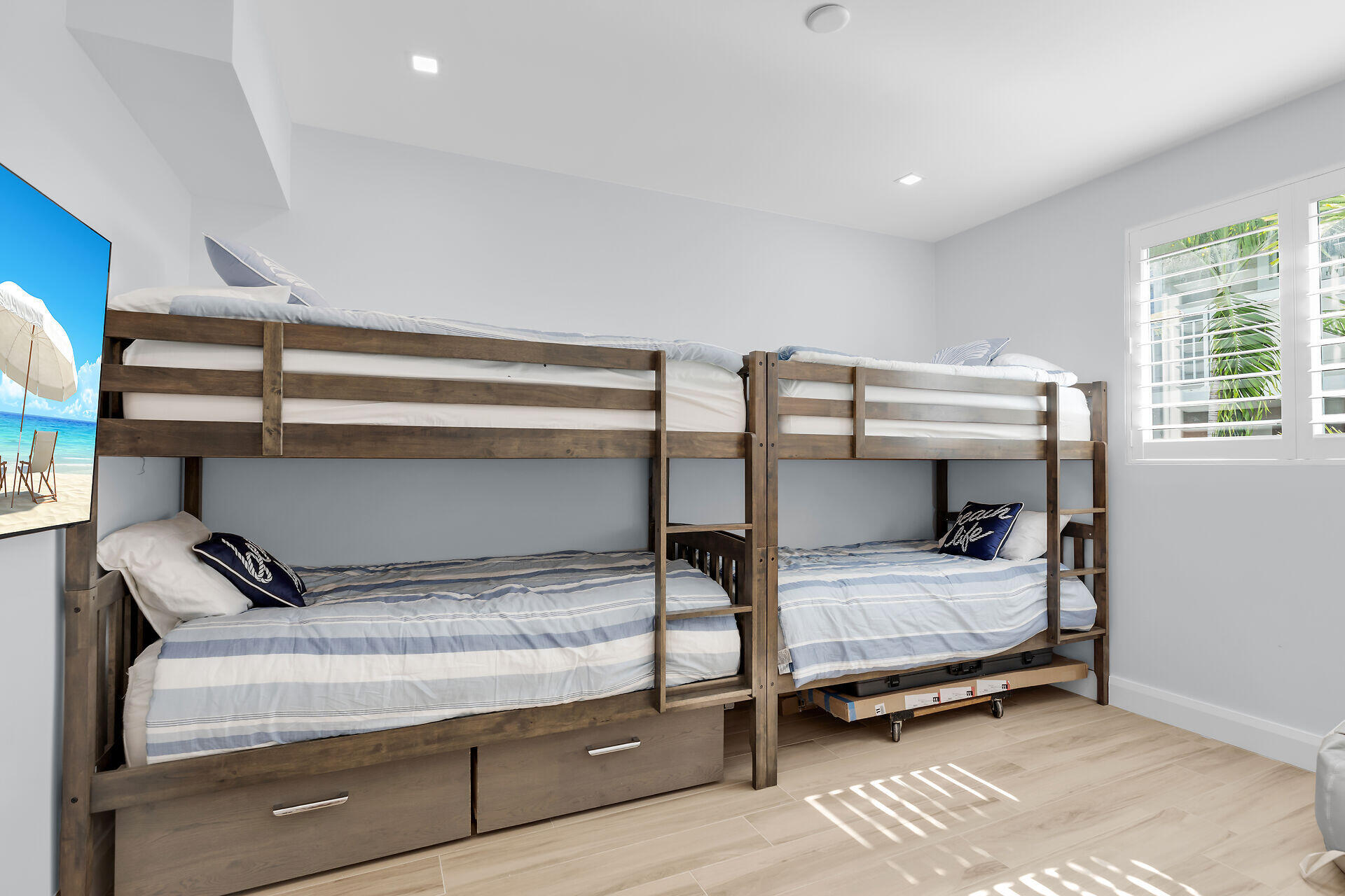 121 Lake Road Tavernier, FL 33070 - Photo 32 of 51 a bedroom with a bed and windows