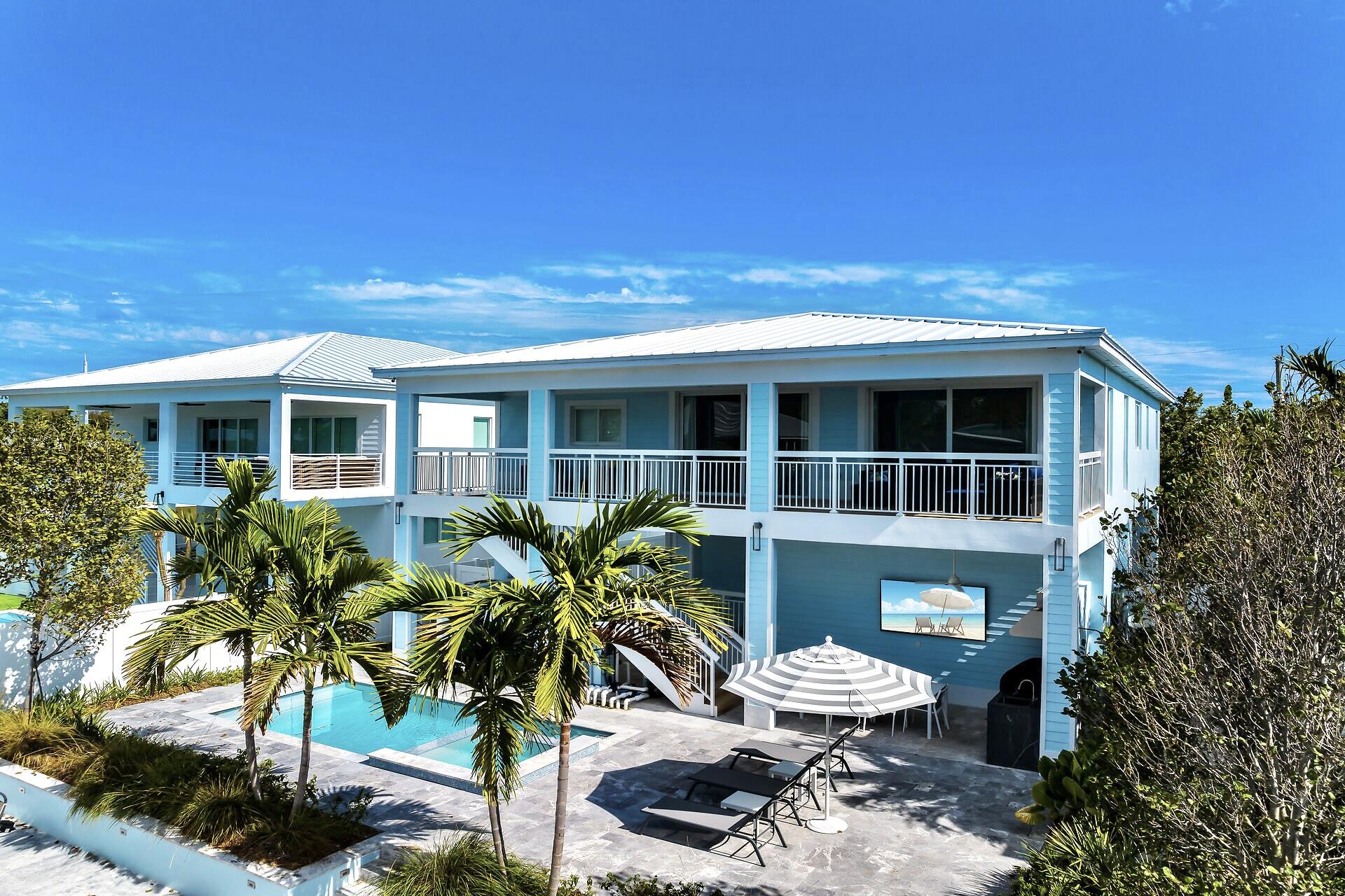 121 Lake Road Tavernier, FL 33070 - Photo 42 of 51 a front view of a house with a yard