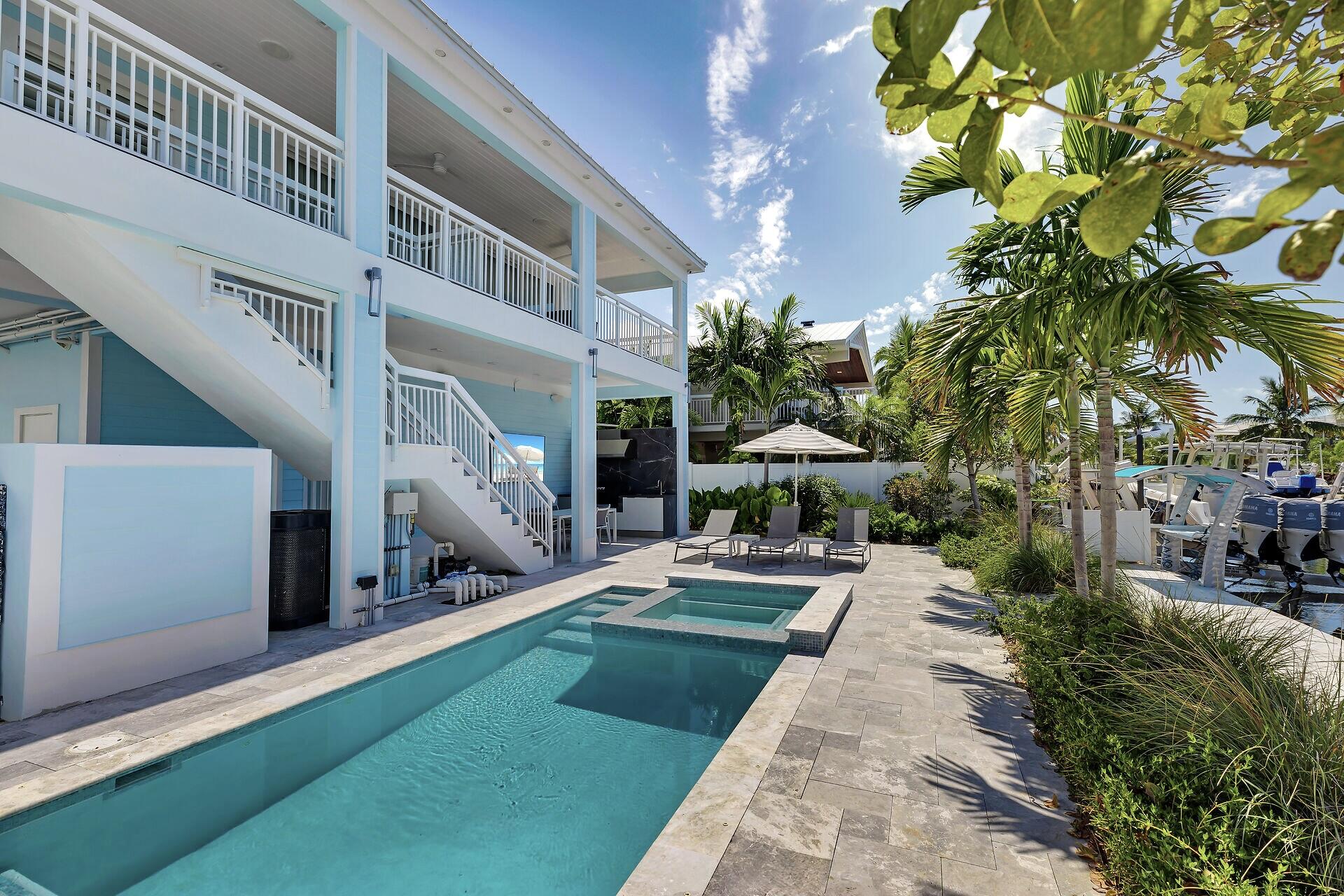 121 Lake Road Tavernier, FL 33070 - Photo 42 of 70 a view of a house with a yard and potted plants