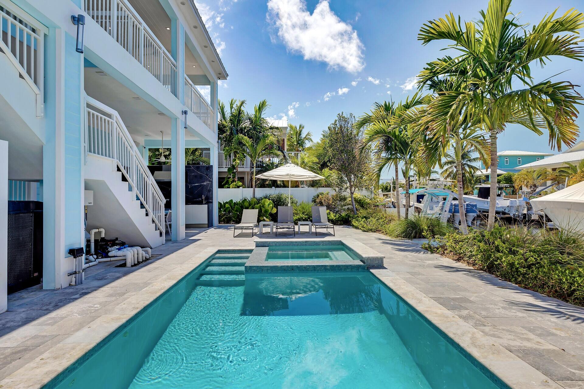 121 Lake Road Tavernier, FL 33070 - Photo 43 of 70 a view of yard with swimming pool and furniture