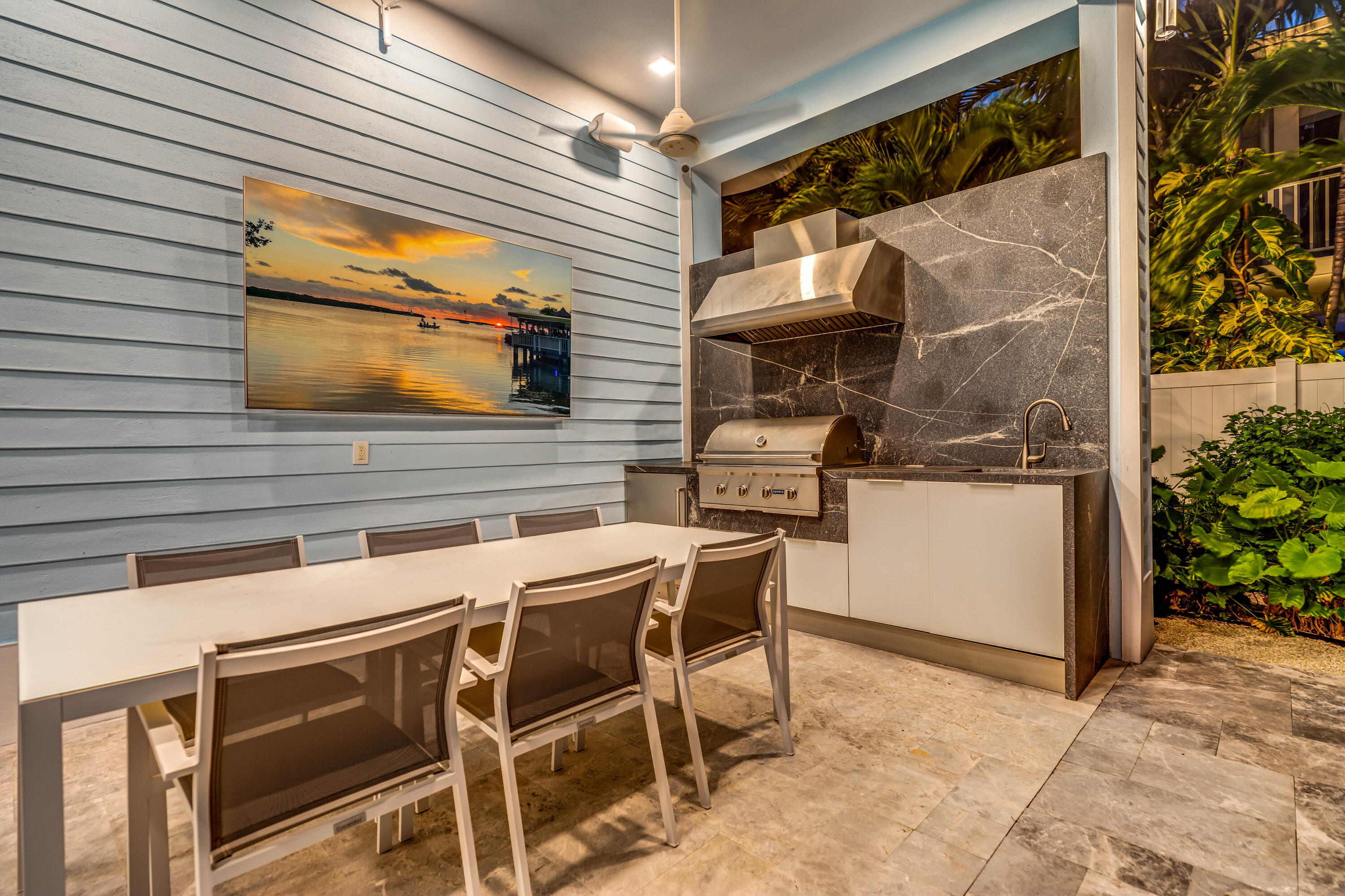 121 Lake Road Tavernier, FL 33070 - Photo 59 of 70 a backyard of a house with barbeque oven table and chairs