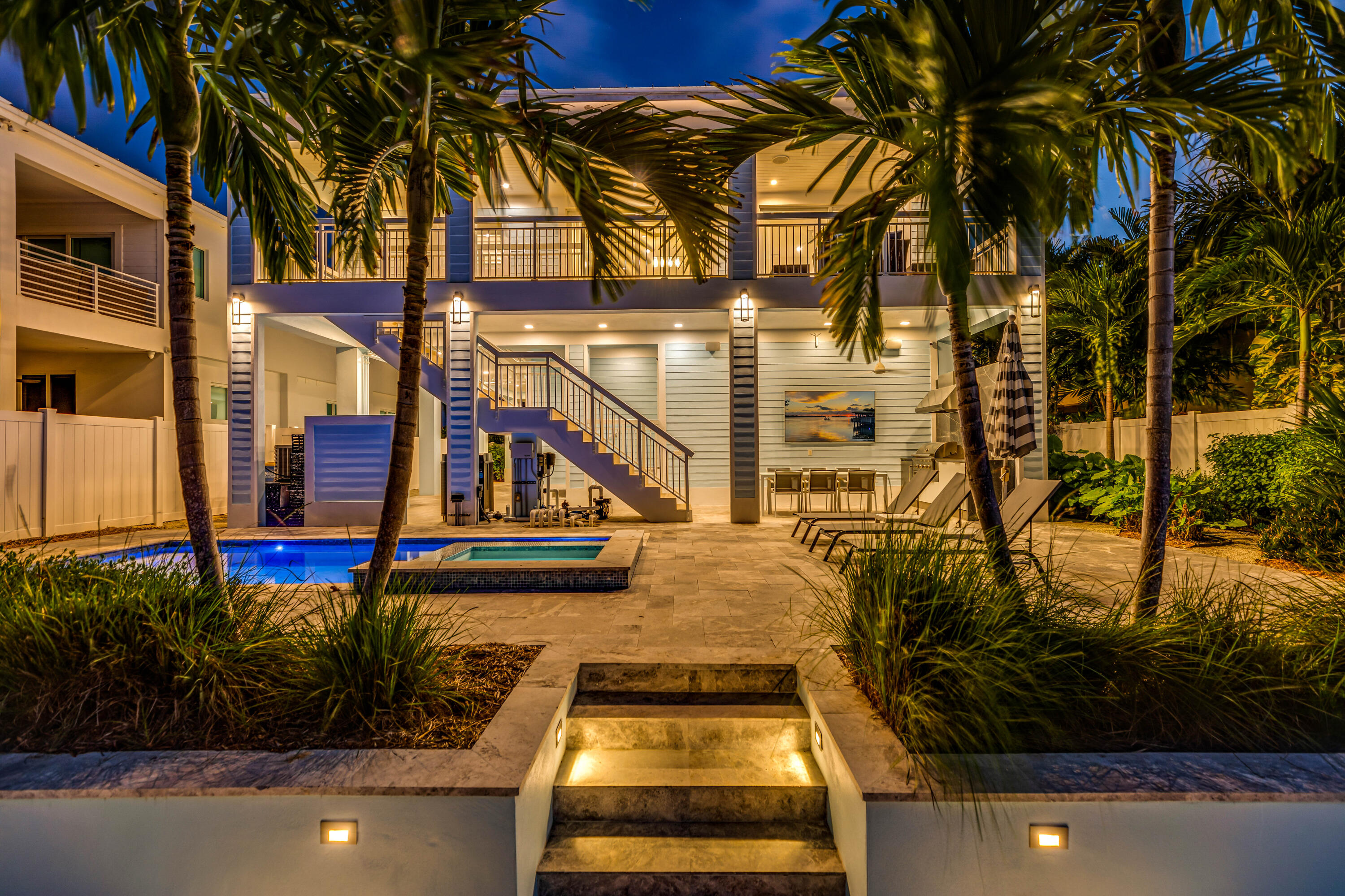 121 Lake Road Tavernier, FL 33070 - Photo 62 of 70 a view of swimming pool with lawn chairs and plants