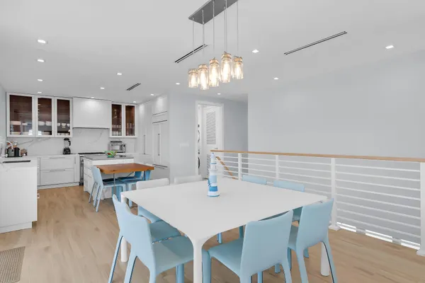 a kitchen with granite countertop a sink stainless steel appliances and cabinets