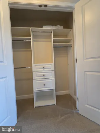 a view of an empty walk in closet