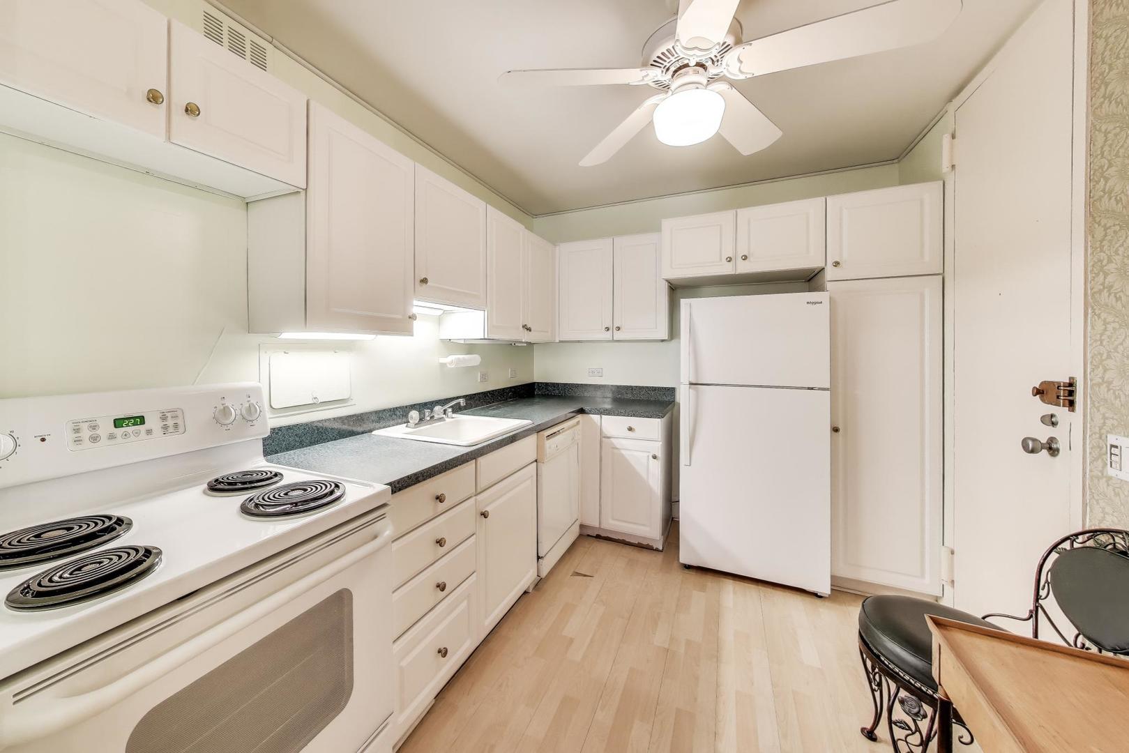 2400 North Lakeview Avenue, Unit 1708 Chicago, IL 60614 - Photo 15 of 50 a kitchen with kitchen island a stove a sink and a refrigerator