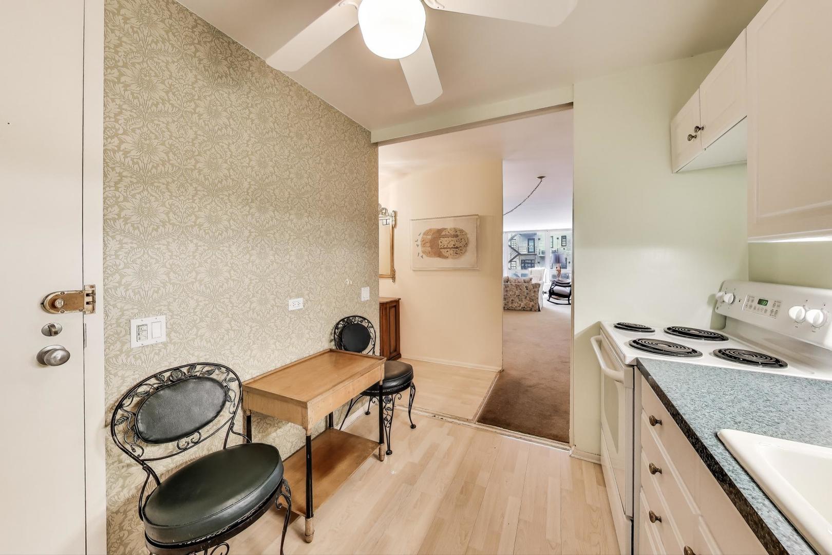 2400 North Lakeview Avenue, Unit 1708 Chicago, IL 60614 - Photo 17 of 50 a kitchen with a sink stove and cabinets