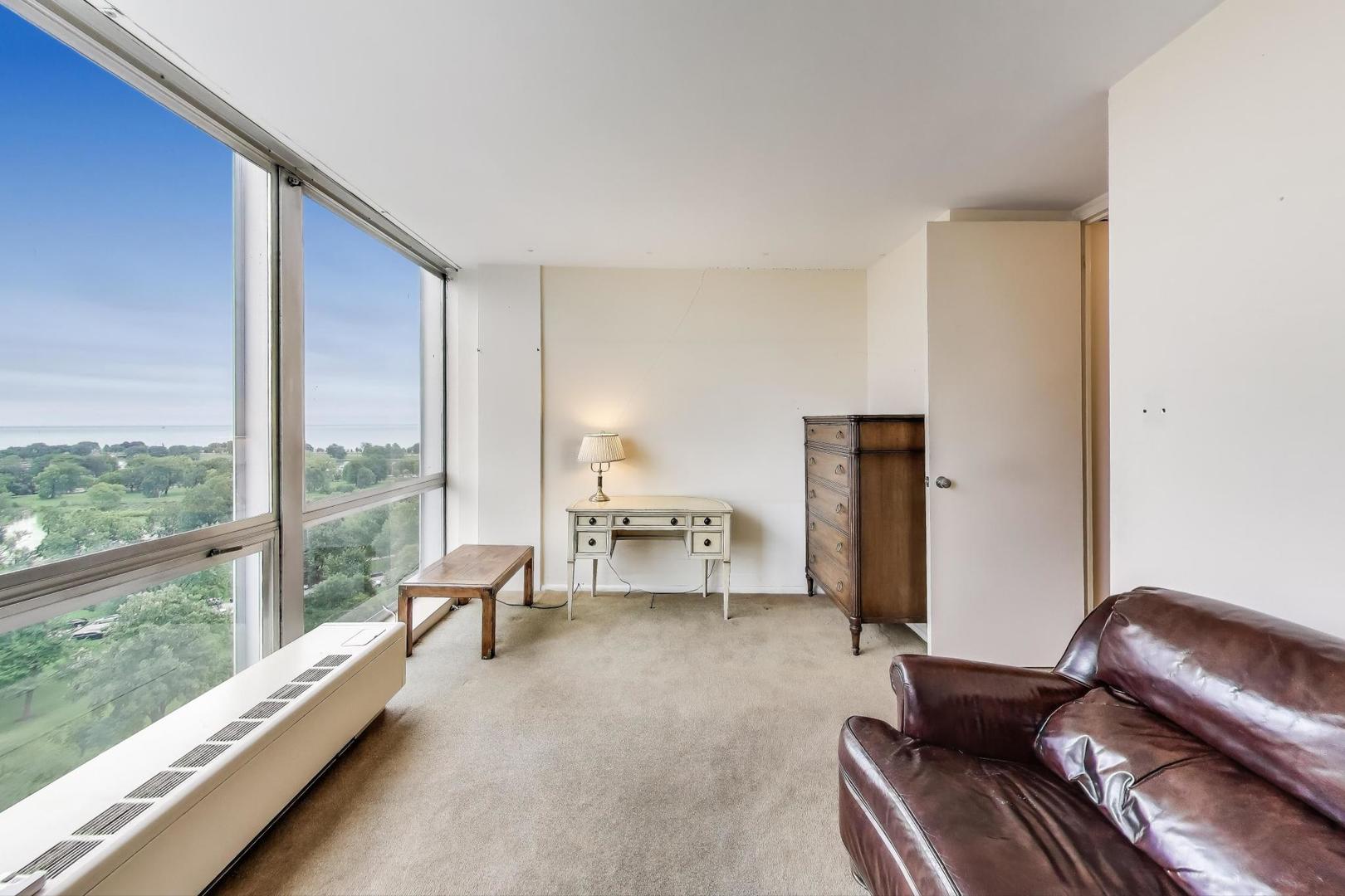 2400 North Lakeview Avenue, Unit 1708 Chicago, IL 60614 - Photo 24 of 50 a living room with furniture and a floor to ceiling window