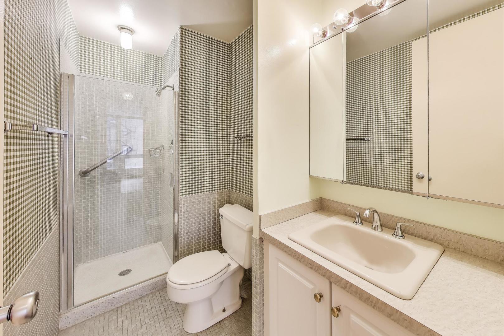 2400 North Lakeview Avenue, Unit 1708 Chicago, IL 60614 - Photo 27 of 50 a bathroom with a sink toilet and shower