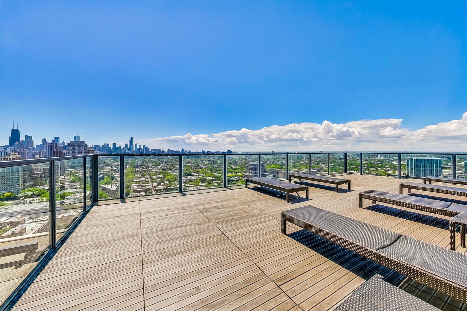 2400 North Lakeview Avenue, Unit 1708 Chicago, IL 60614 - Photo 30 of 50 a view of a roof deck with couches and city view