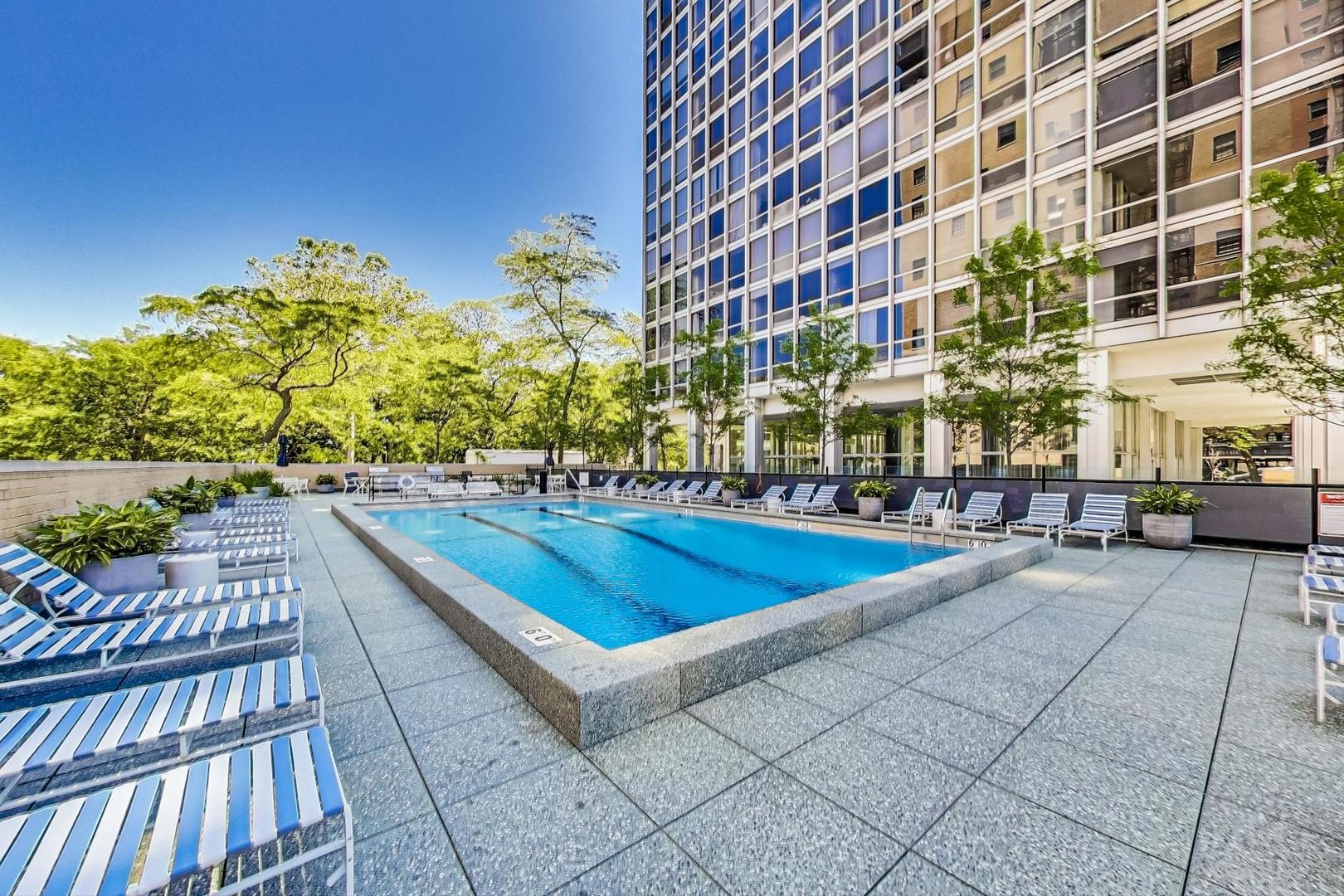 2400 North Lakeview Avenue, Unit 1708 Chicago, IL 60614 - Photo 35 of 50 a view of a swimming pool with a lounge chairs