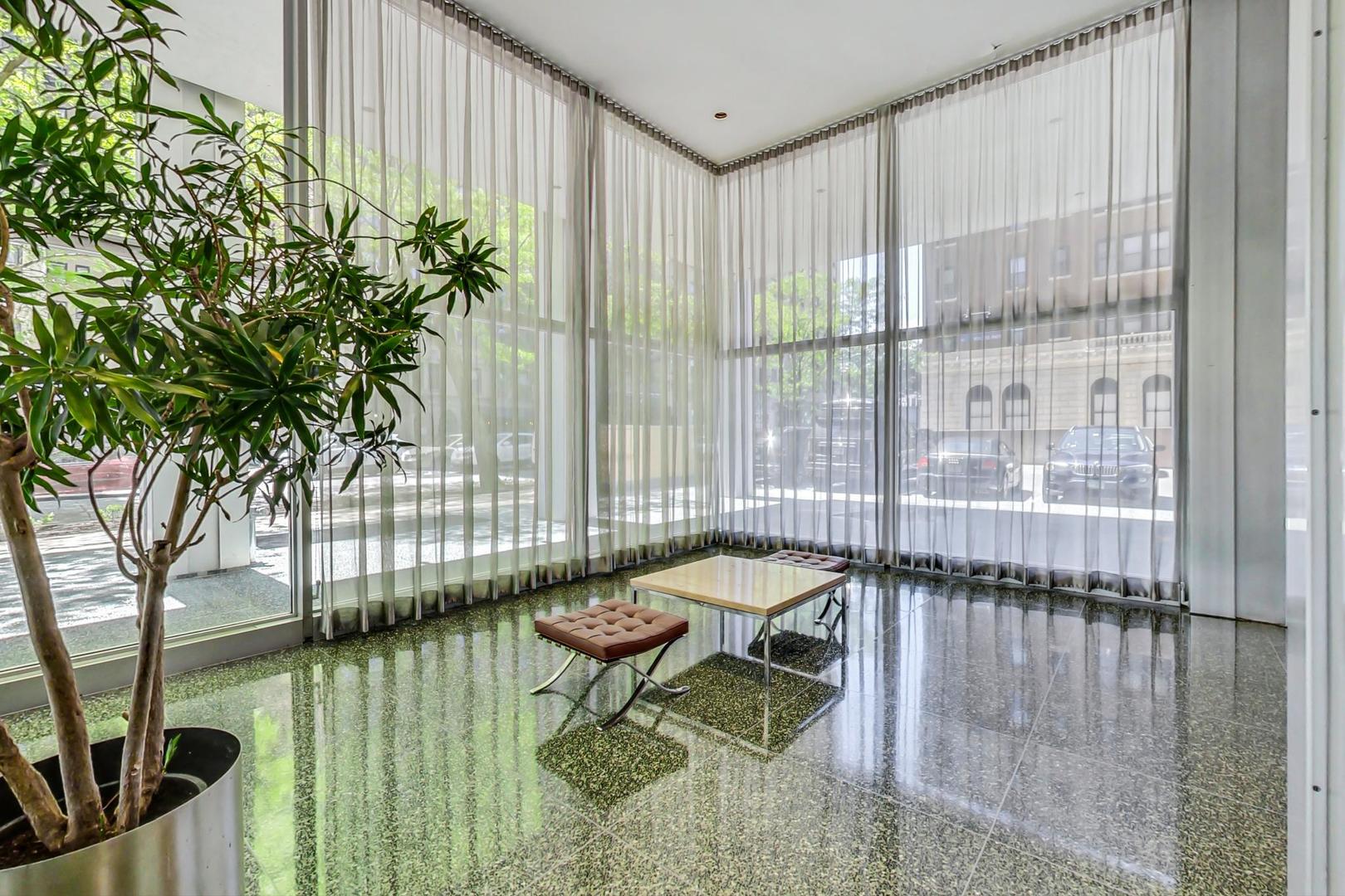 2400 North Lakeview Avenue, Unit 1708 Chicago, IL 60614 - Photo 4 of 50 a living room filled with furniture and a potted plant