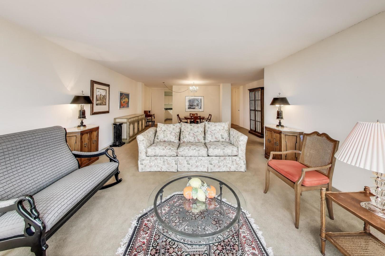 2400 North Lakeview Avenue, Unit 1708 Chicago, IL 60614 - Photo 10 of 50 a living room with furniture and a lamp