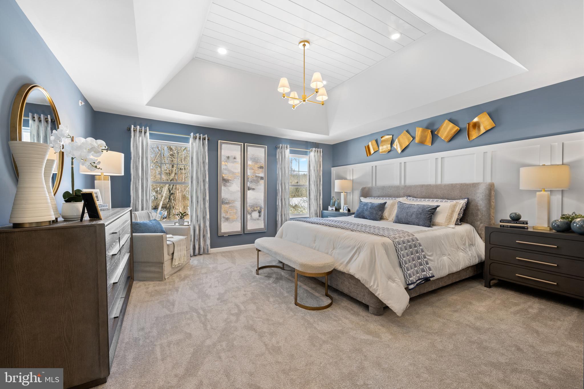 156 Bancroft Road, Unit CARLTON Kennett Square, PA 19348 - Photo 13 of 47 a spacious bedroom with a bed a chandelier and large window