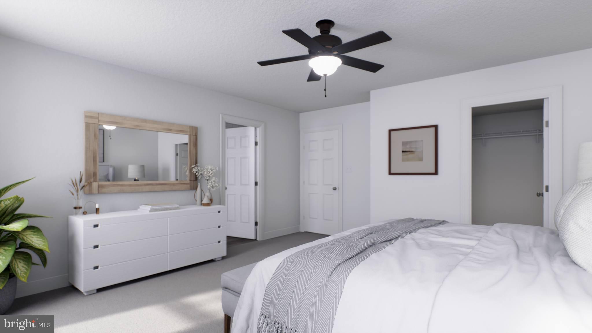 156 Bancroft Road, Unit CARLTON Kennett Square, PA 19348 - Photo 14 of 46 a bedroom with a large bed and a chandelier