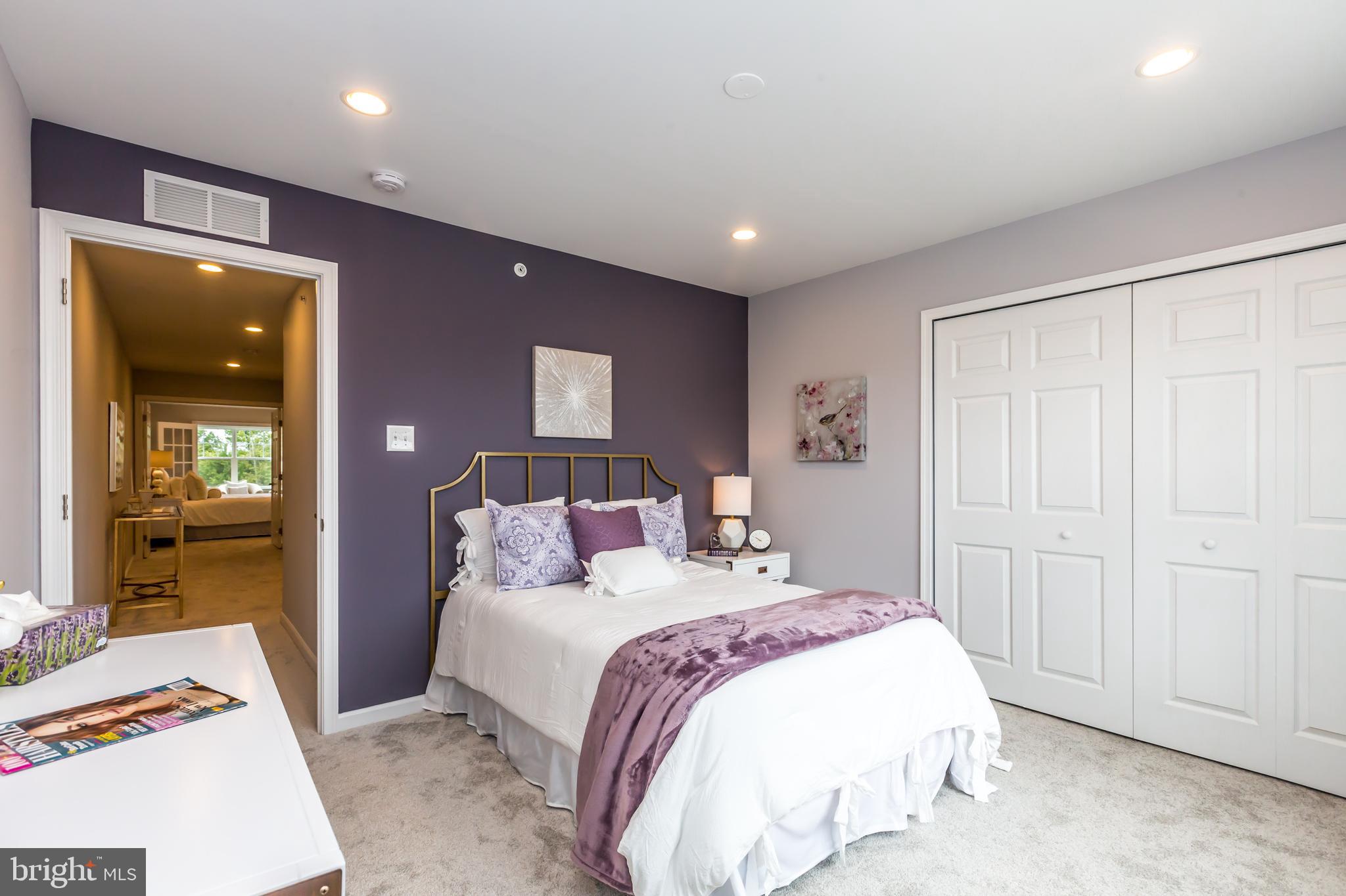 156 Bancroft Road, Unit CARLTON Kennett Square, PA 19348 - Photo 18 of 46 a bedroom with a large bed and a closet