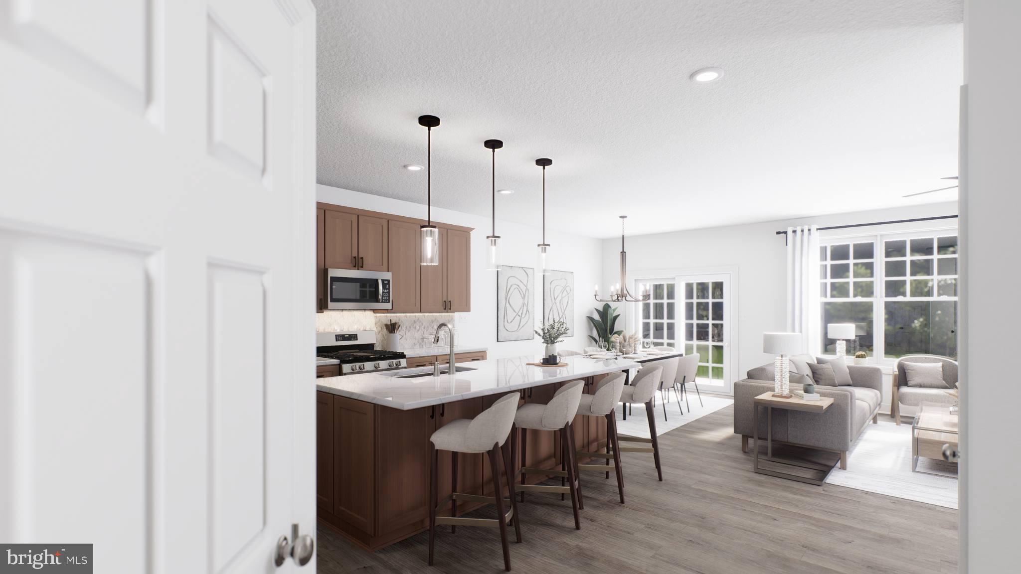 156 Bancroft Road, Unit CARLTON Kennett Square, PA 19348 - Photo 2 of 46 a dining room with stainless steel appliances kitchen island granite countertop a sink table and chairs