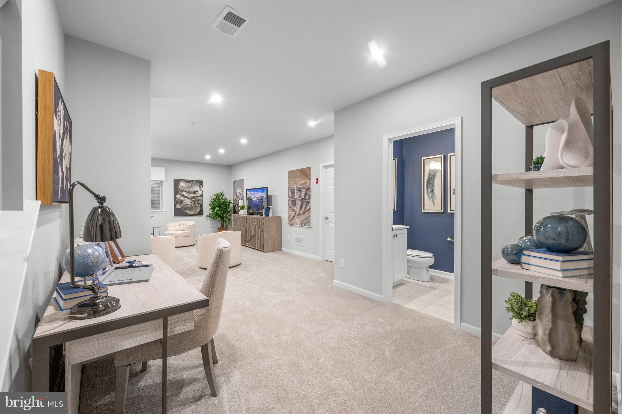 156 Bancroft Road, Unit CARLTON Kennett Square, PA 19348 - Photo 23 of 47 a living room with furniture a desk and chair