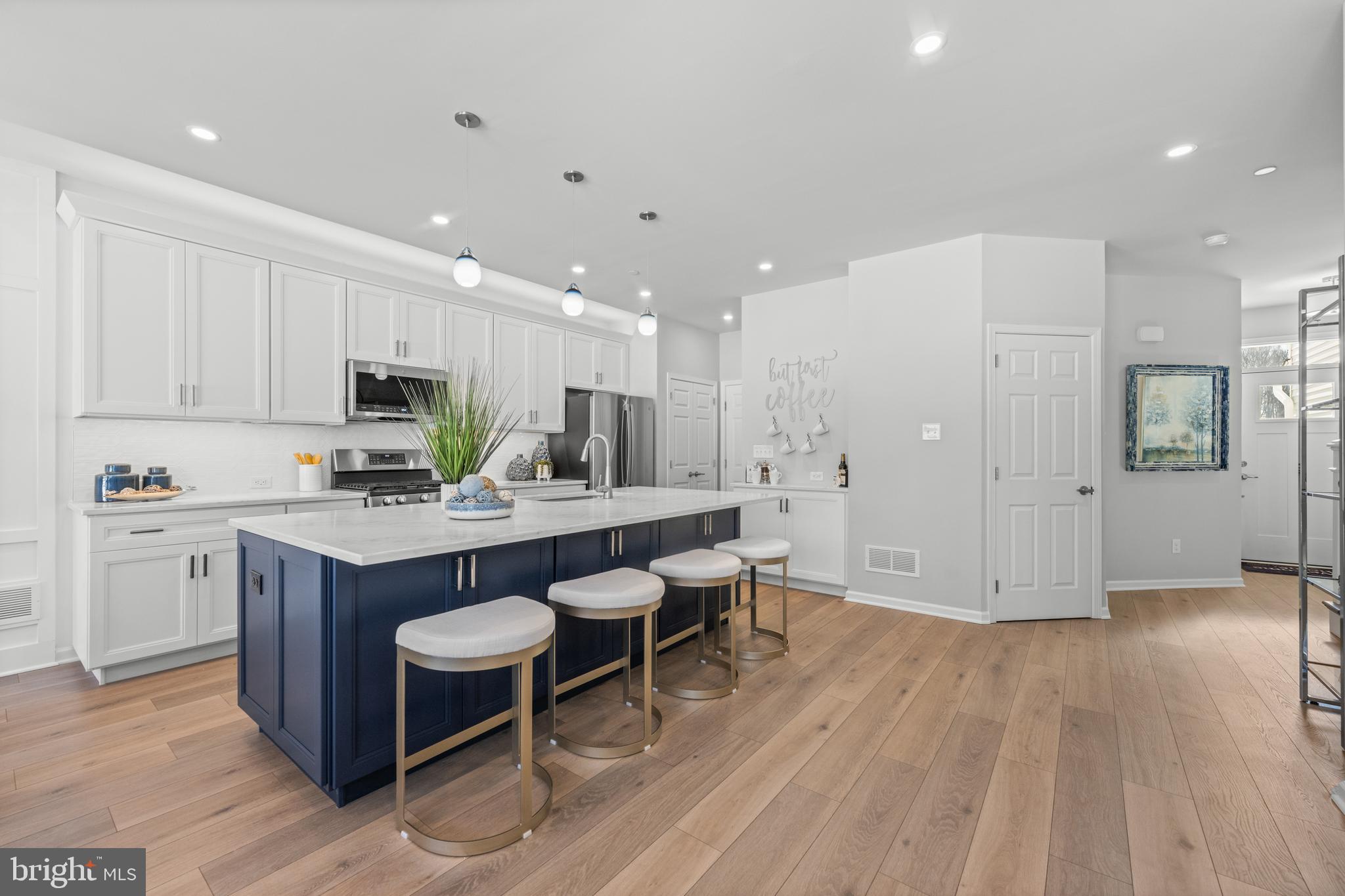 156 Bancroft Road, Unit CARLTON Kennett Square, PA 19348 - Photo 4 of 47 a kitchen with cabinets and wooden floor