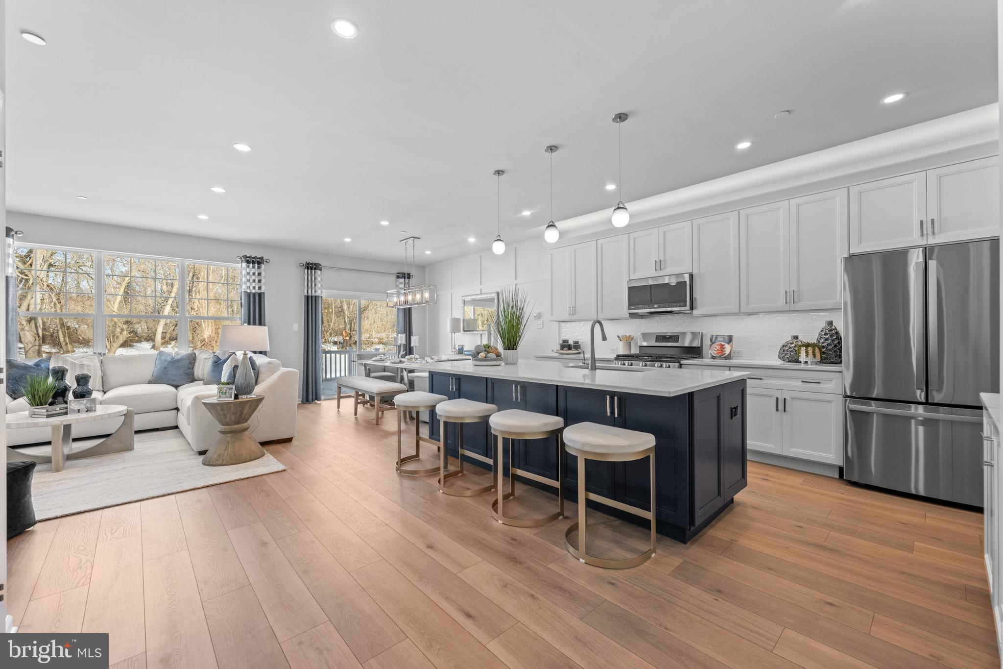 156 Bancroft Road, Unit CARLTON Kennett Square, PA 19348 - Photo 5 of 47 a kitchen with a sink appliances and wooden floor