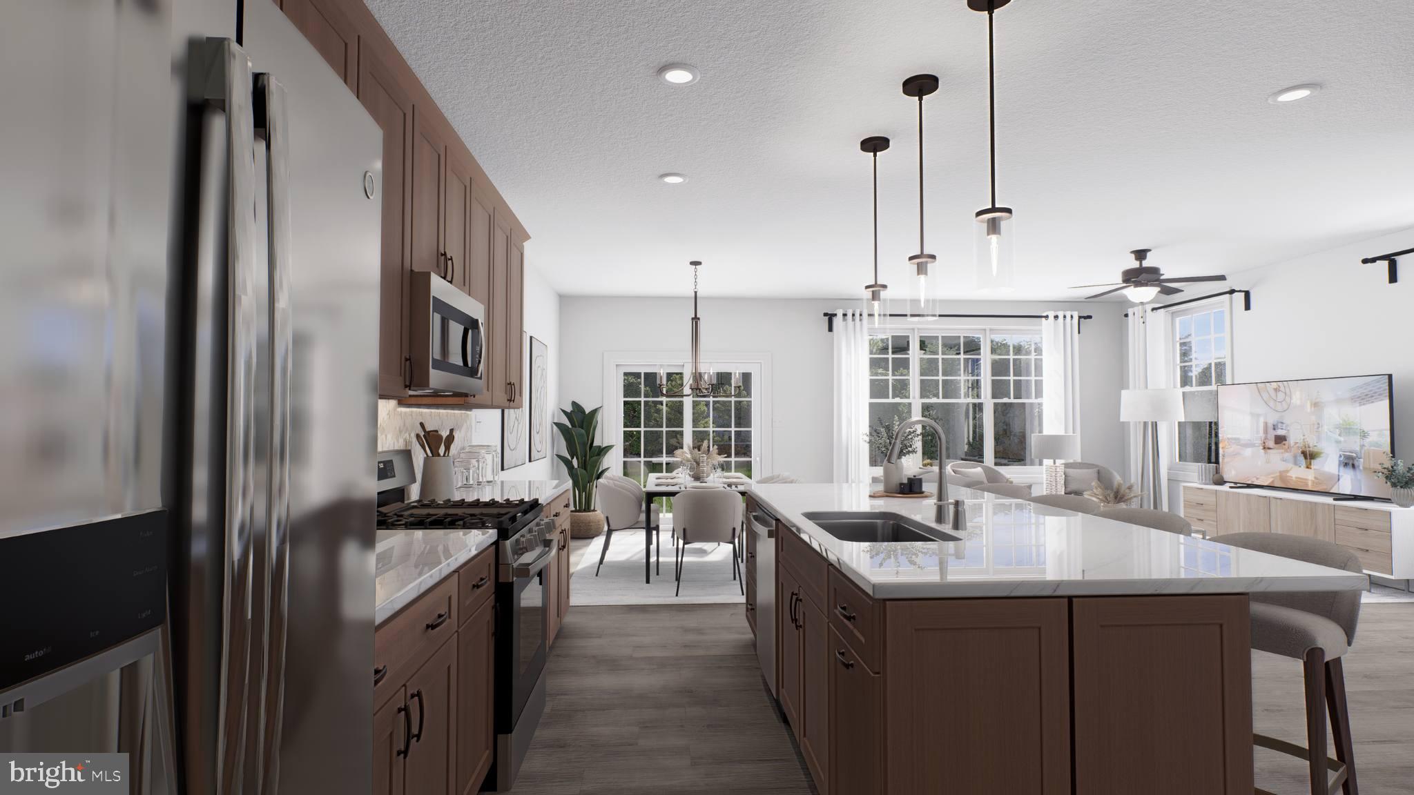 156 Bancroft Road, Unit CARLTON Kennett Square, PA 19348 - Photo 5 of 46 a kitchen with kitchen island granite countertop a sink counter top space appliances and cabinets