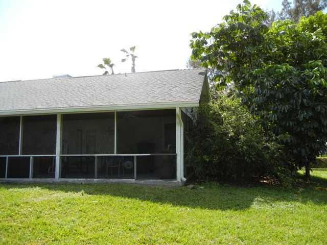 9759 Sandy Run Road Jupiter, FL 33478 - Photo 5 of 7 a view of a backyard with floor to ceiling window and plants