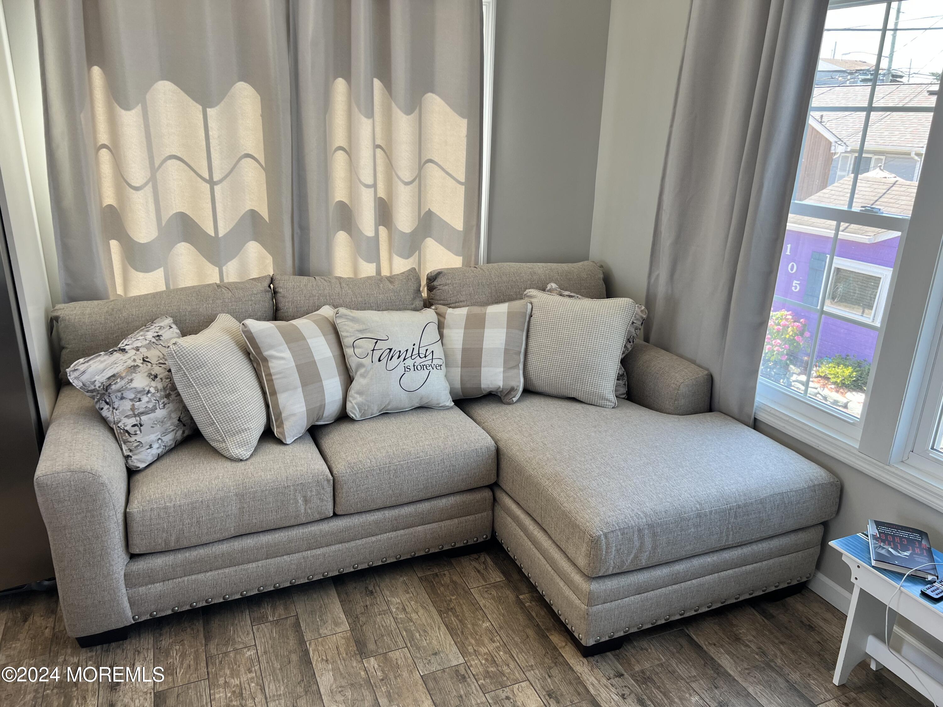 104 West Chadwick Way Lavallette, NJ 08735 - Photo 6 of 13 a living room with a couch and a table