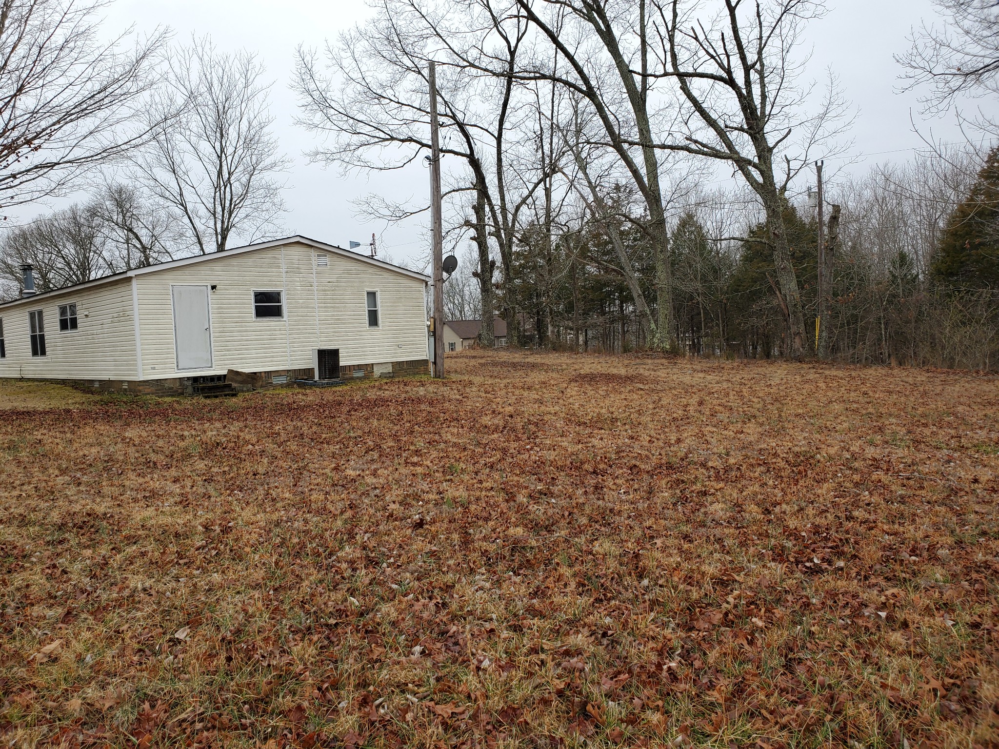 4531 Akin Road Cunningham, TN 37052 - Photo 5 of 10 a view of a house with a yard