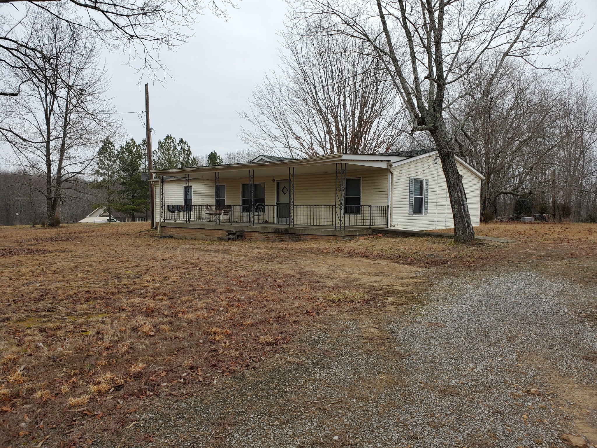 4531 Akin Road Cunningham, TN 37052 - Photo 10 of 10 a front view of house with yard and trees around