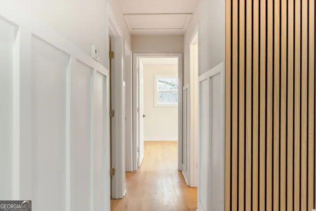 a view of a bathroom with wooden floor