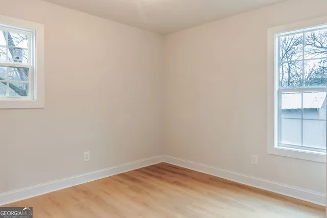 an empty room with windows