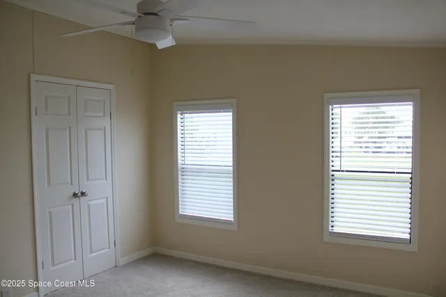 a view of a hallway with closet