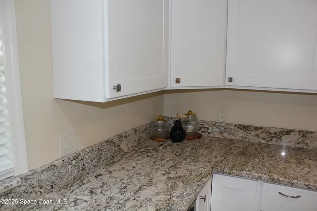 a close view of sink and cabinets