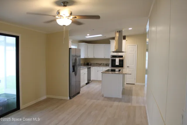 a view of a door with wooden floors