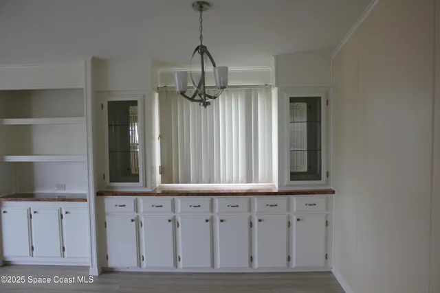 a front view of a house with a garden and entryway