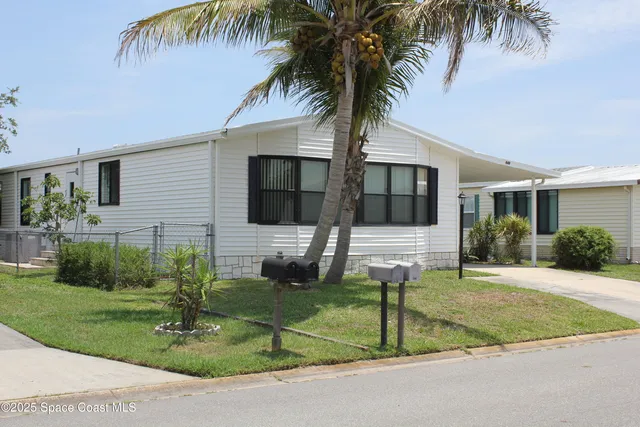 a kitchen with a refrigerator and a sink