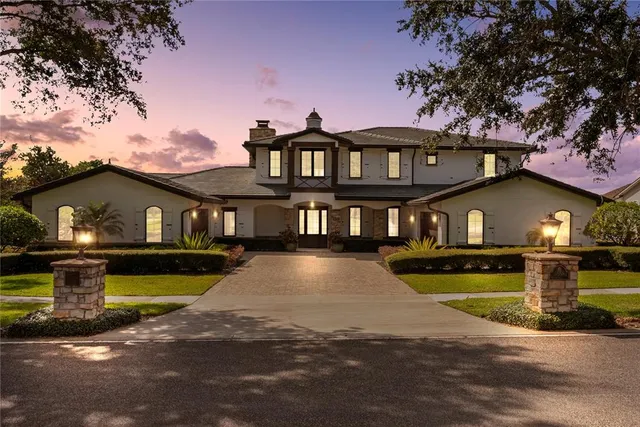 a front view of a house with a yard bathtub and fire pit